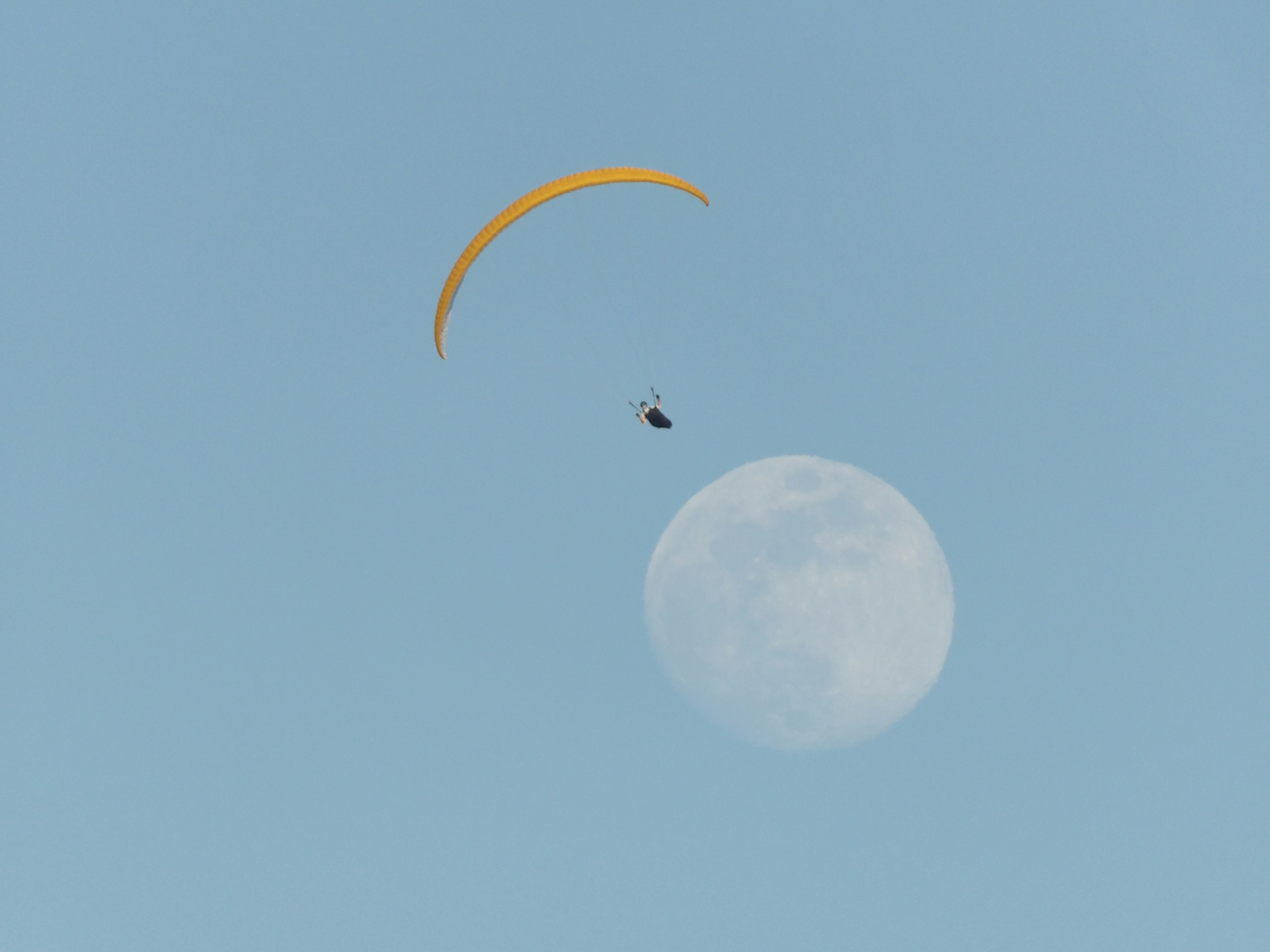 image of person flying towards moon